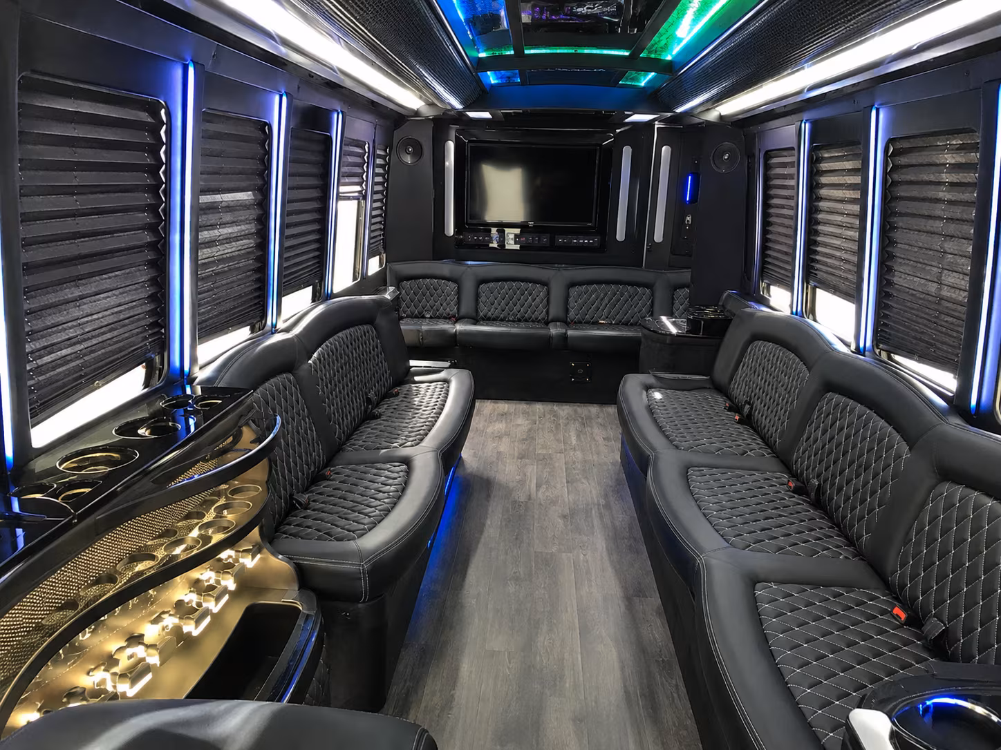 Wedding guests seated inside a party bus serving Olathe